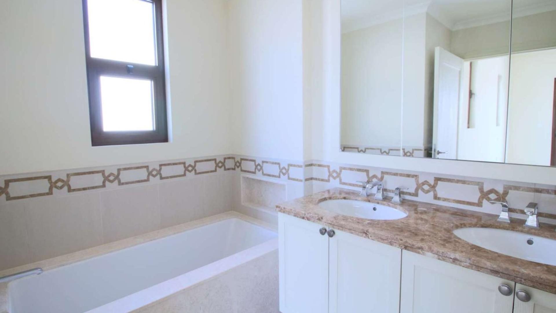 Bright empty room with arched windows in Rasha villa, Arabian Ranches 2