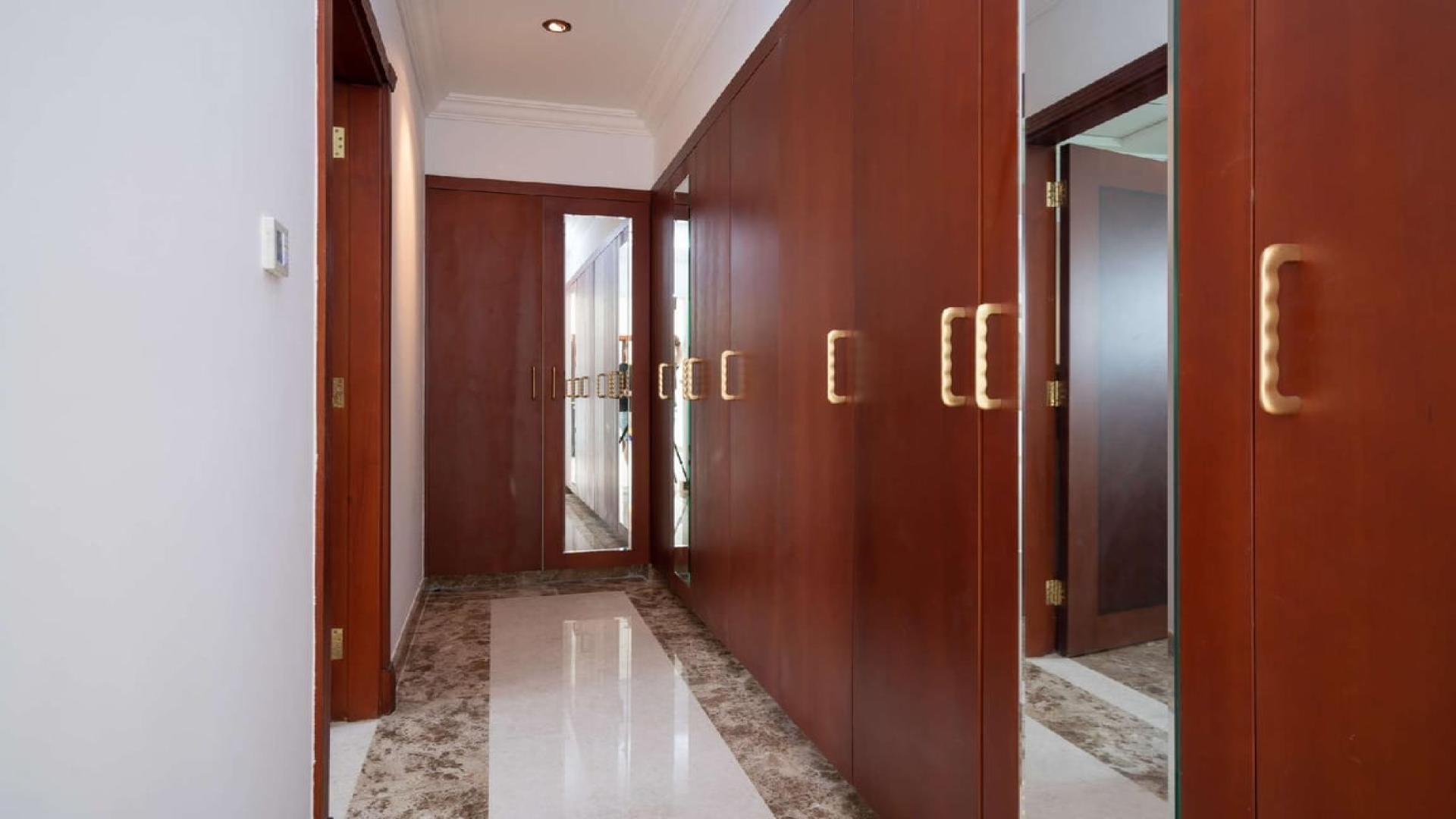 Spacious kitchen in 5-bedroom villa, Jumeirah Golf Estates, Fire community, modern wooden cabinets