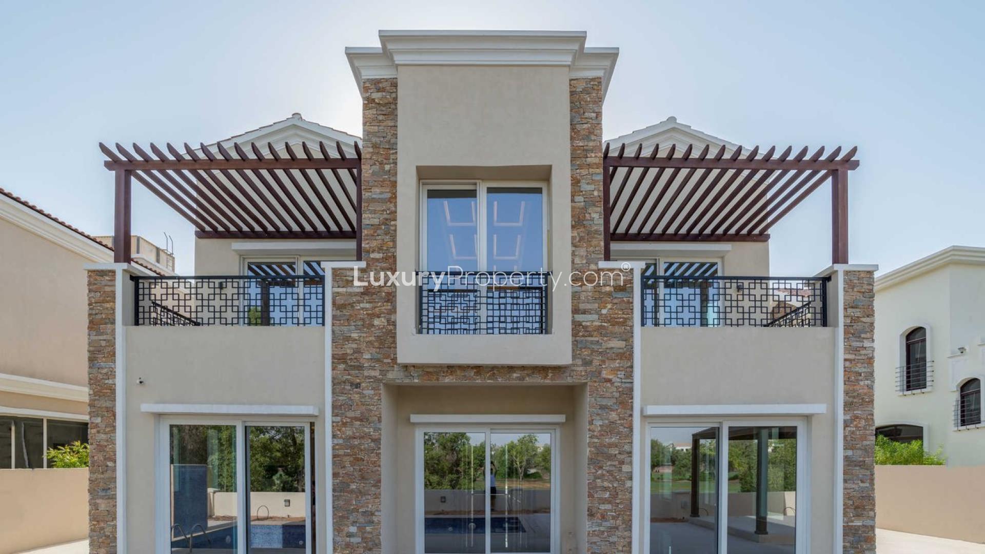 Contemporary five-bedroom villa exterior in Jumeirah Golf Estates, Earth community, for sale