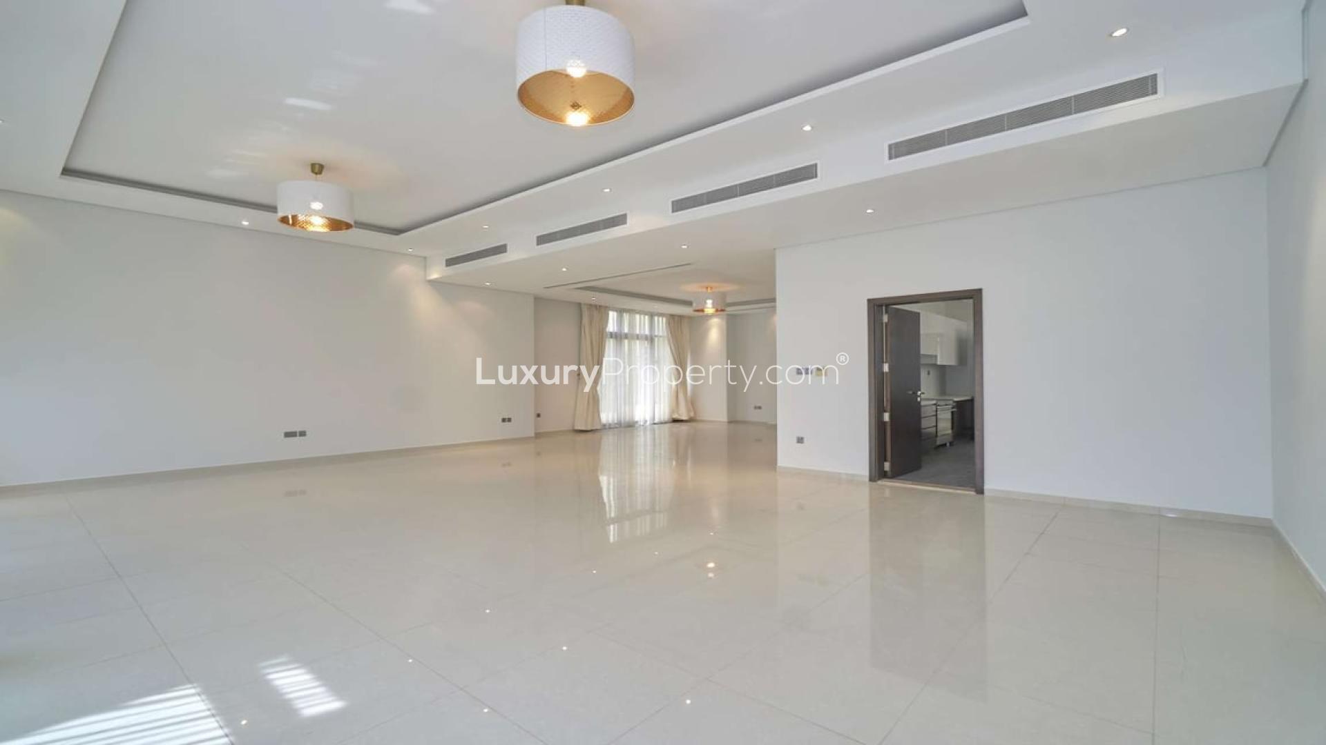 Spacious living area with large windows in Brookfield villa, Damac Hills for sale