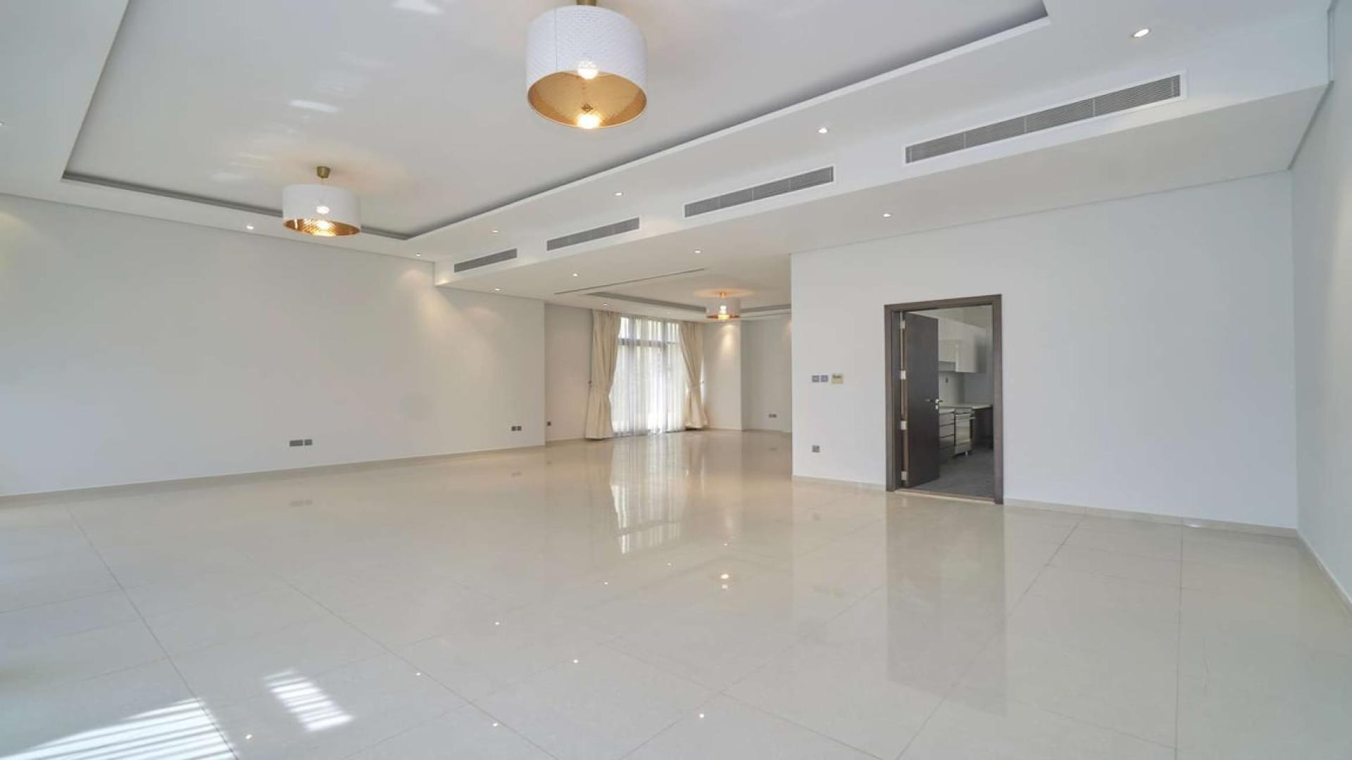 Spacious living area with large windows in Brookfield villa, Damac Hills for sale