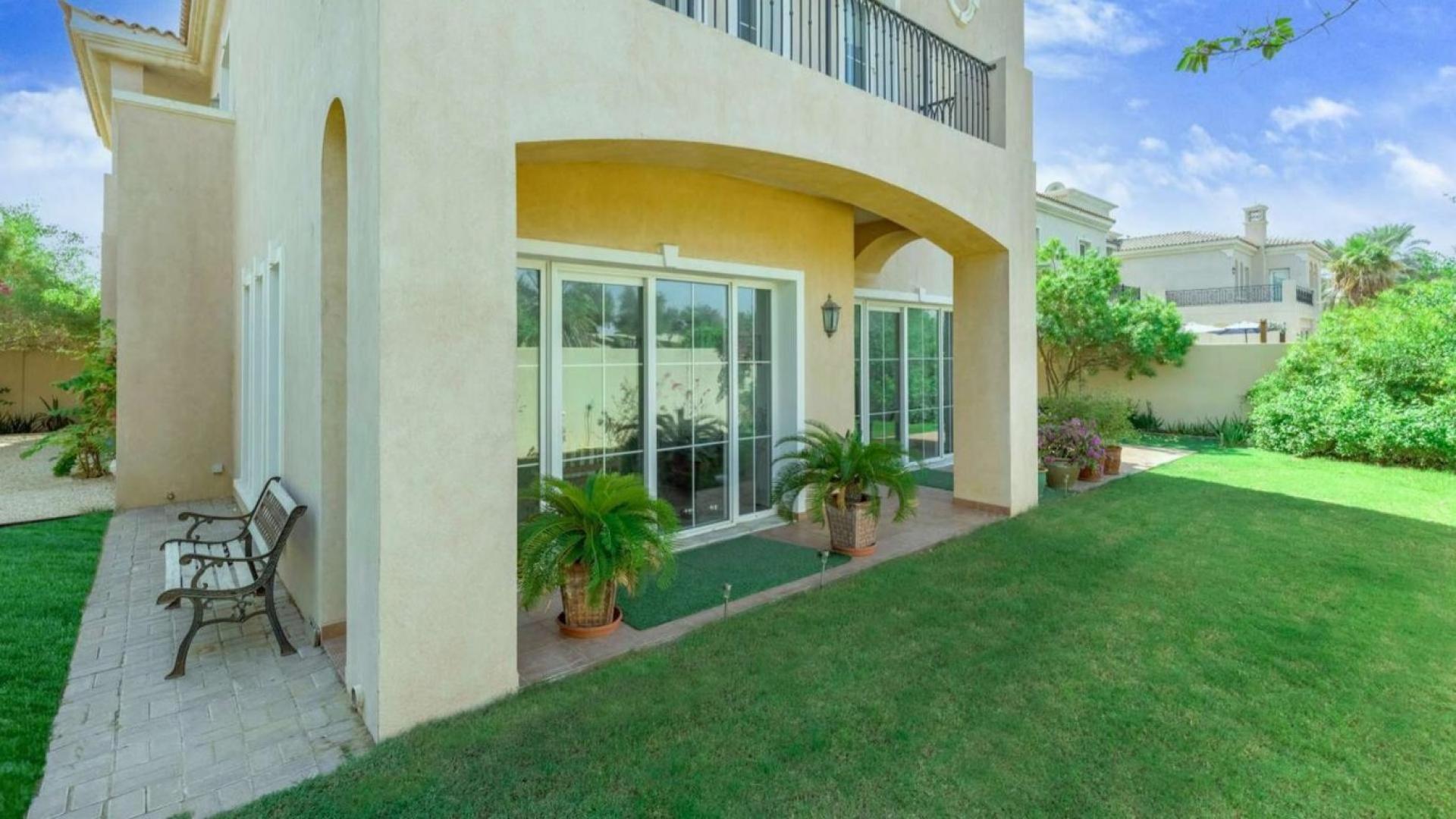 "Charming entrance of luxury villa in Mirador, Arabian Ranches with lush greenery.","Charming garden view at luxury villa in Mirador, Arabian Ranches, with lush greenery.",Luxurious Mirador villa garden with lush greenery and bench, Arabian Ranches