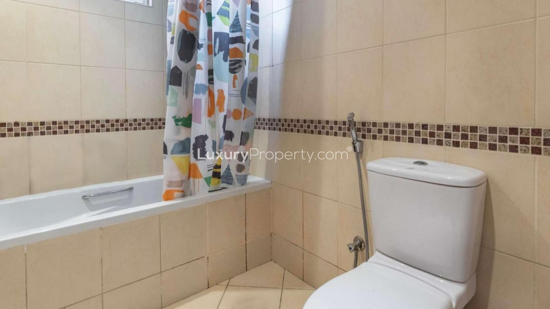 Luxury villa exterior with lush garden in Mirador, Arabian Ranches, Dubai, for sale