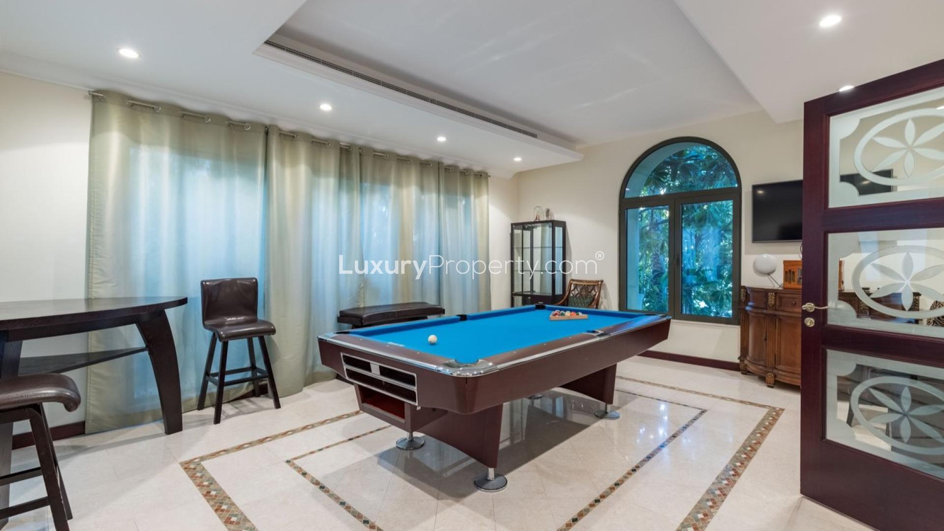 Luxurious beachfront villa on Palm Jumeirah with stunning architecture and garden view