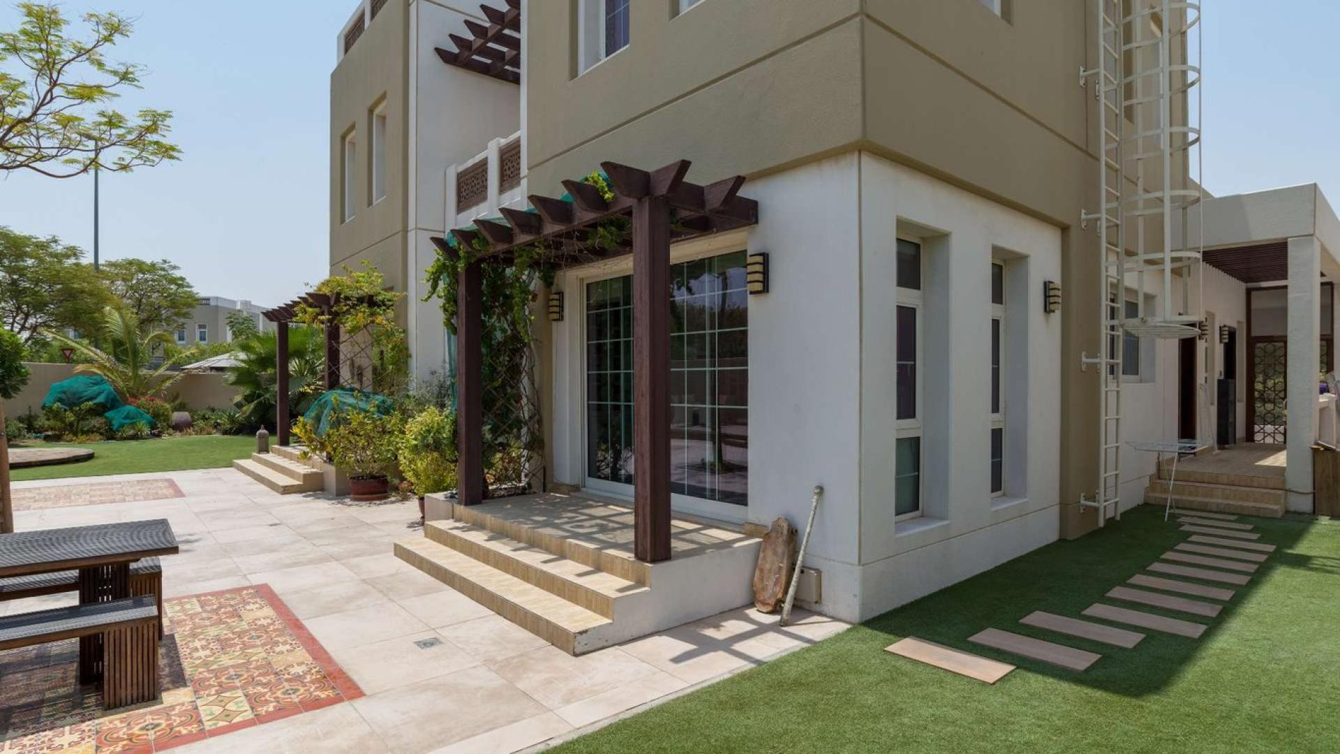 Corner villa on large plot in Rahat, Mudon, featuring modern architecture and lush greenery