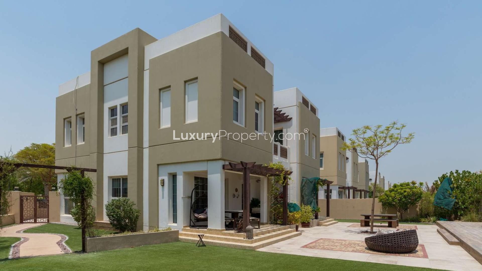 Stunning 5-bedroom villa exterior in Rahat, Mudon with landscaped garden and patio area