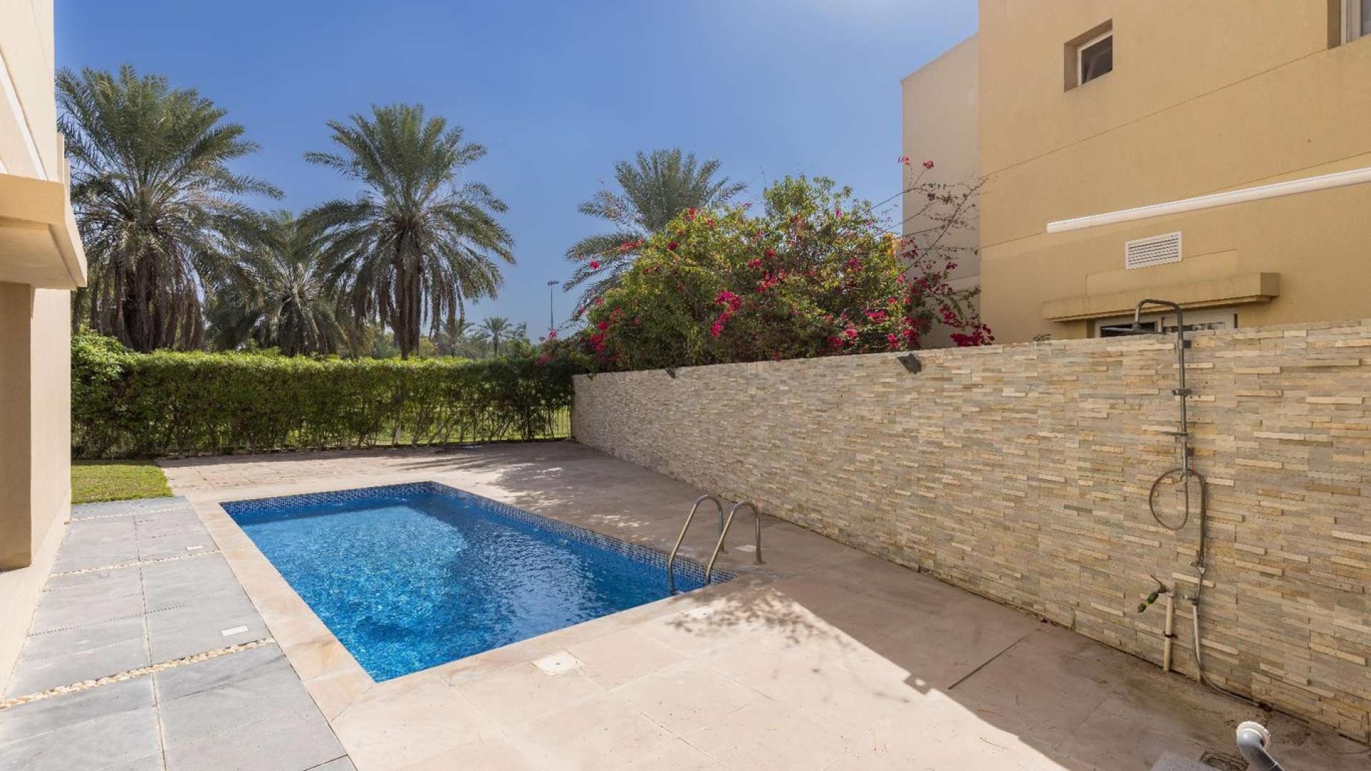 Spacious villa interior with marble flooring and large windows in Meadows community