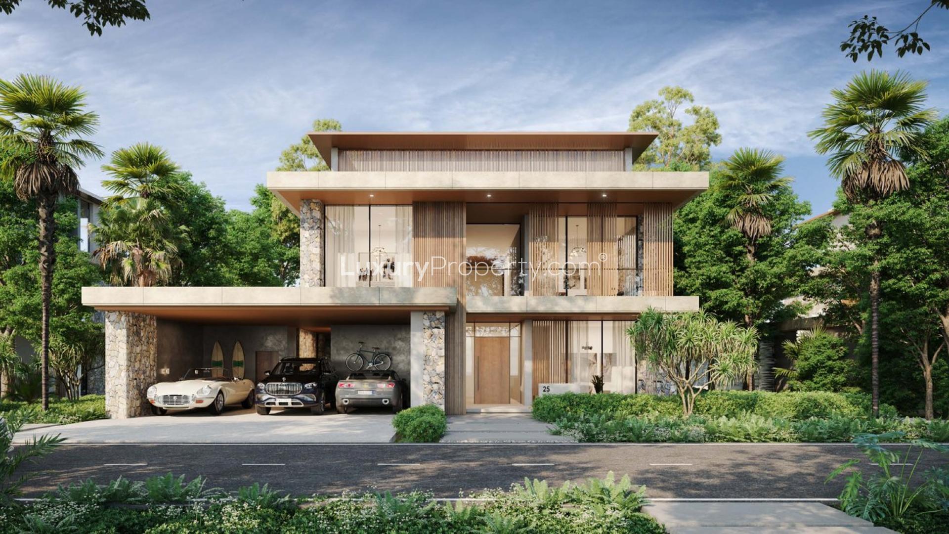 Stunning modern five-bedroom villa exterior in Alaya, Tilal Al Ghaf, surrounded by lush greenery