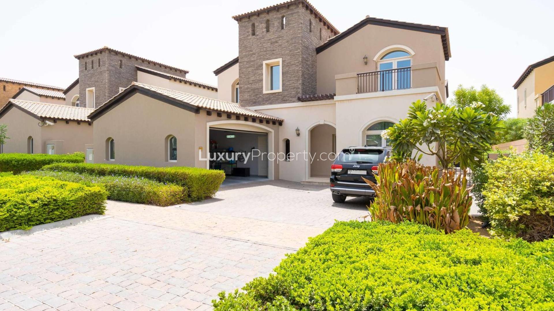 Front view of spacious 5-bedroom villa in Sienna Lakes, Jumeirah Golf Estates, with lush landscaping