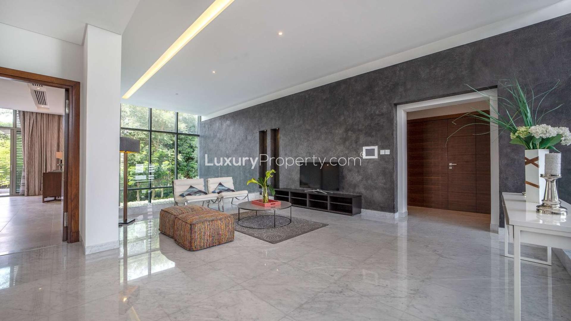 Luxurious living room in District One villa, featuring modern decor and large windows