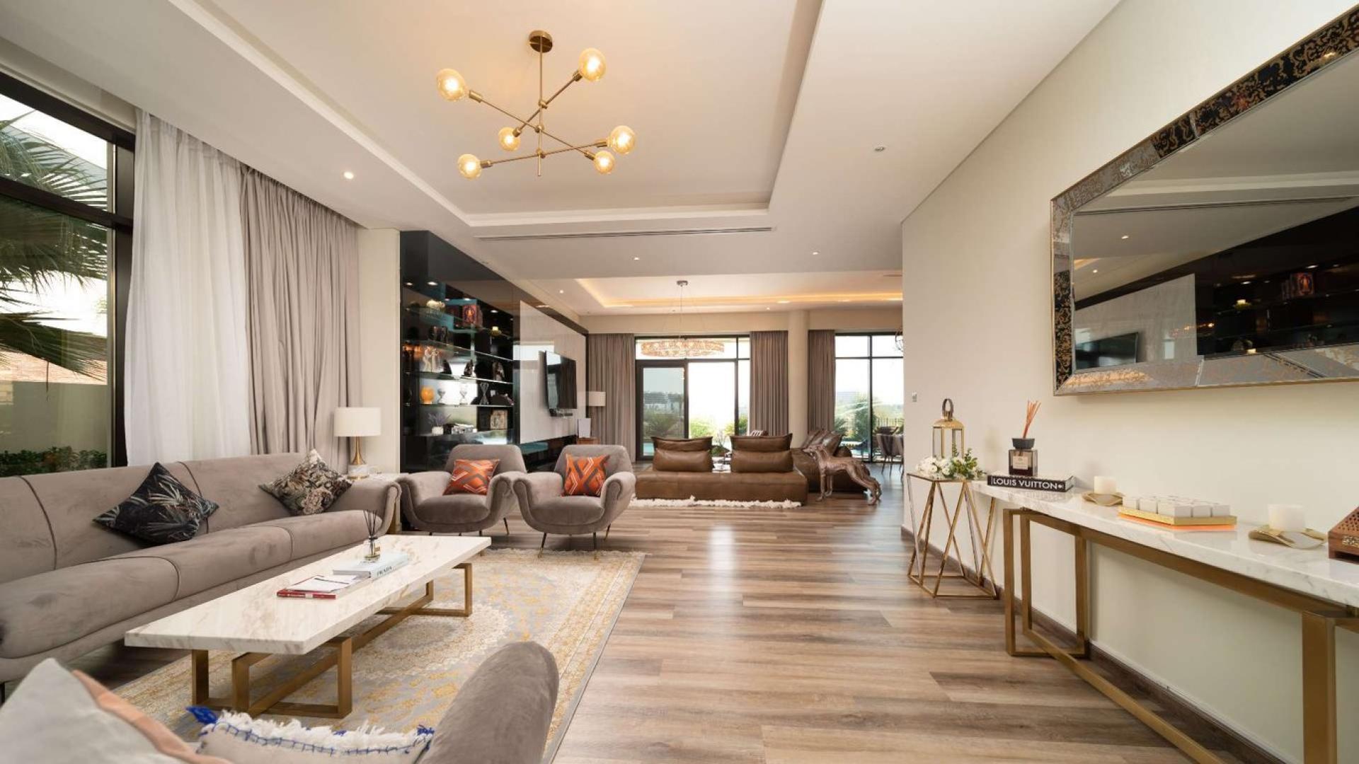 Luxurious villa pool with golf course view in Damac Hills, Brookfield community