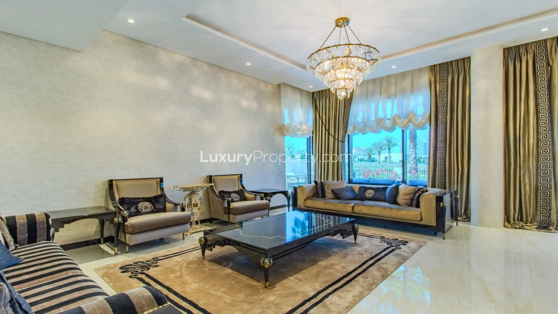 Luxurious living room in upgraded Flora villa, Damac Hills, featuring elegant decor and grand piano