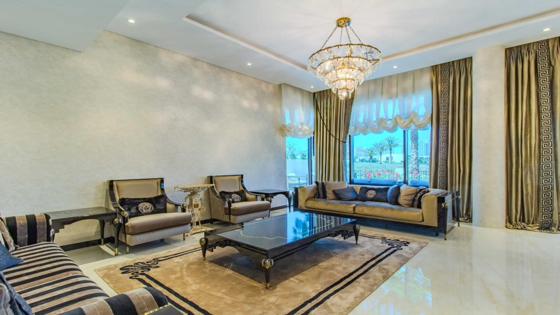 Luxurious living room in upgraded Flora villa, Damac Hills, featuring elegant decor and grand piano