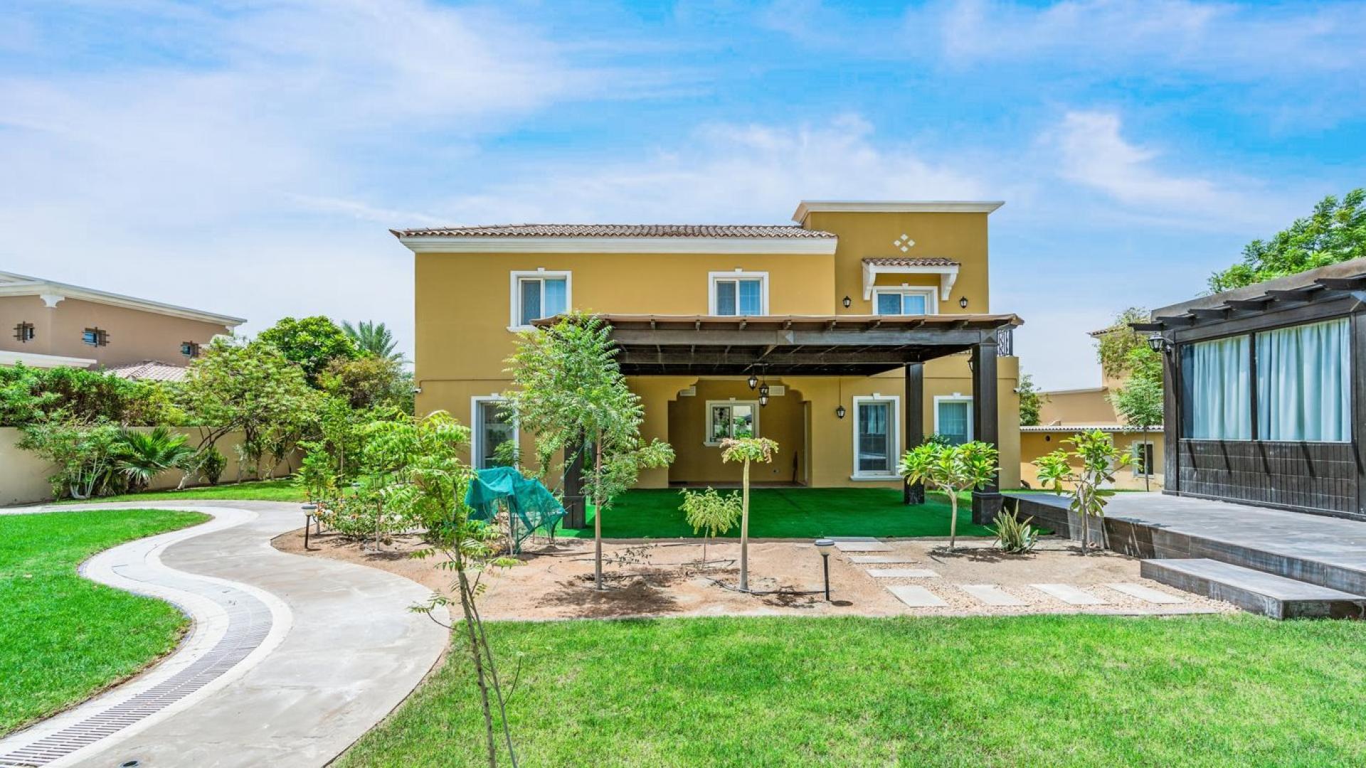 Upgraded 5-bedroom villa exterior with lush garden in Mirador La Coleccion, Arabian Ranches