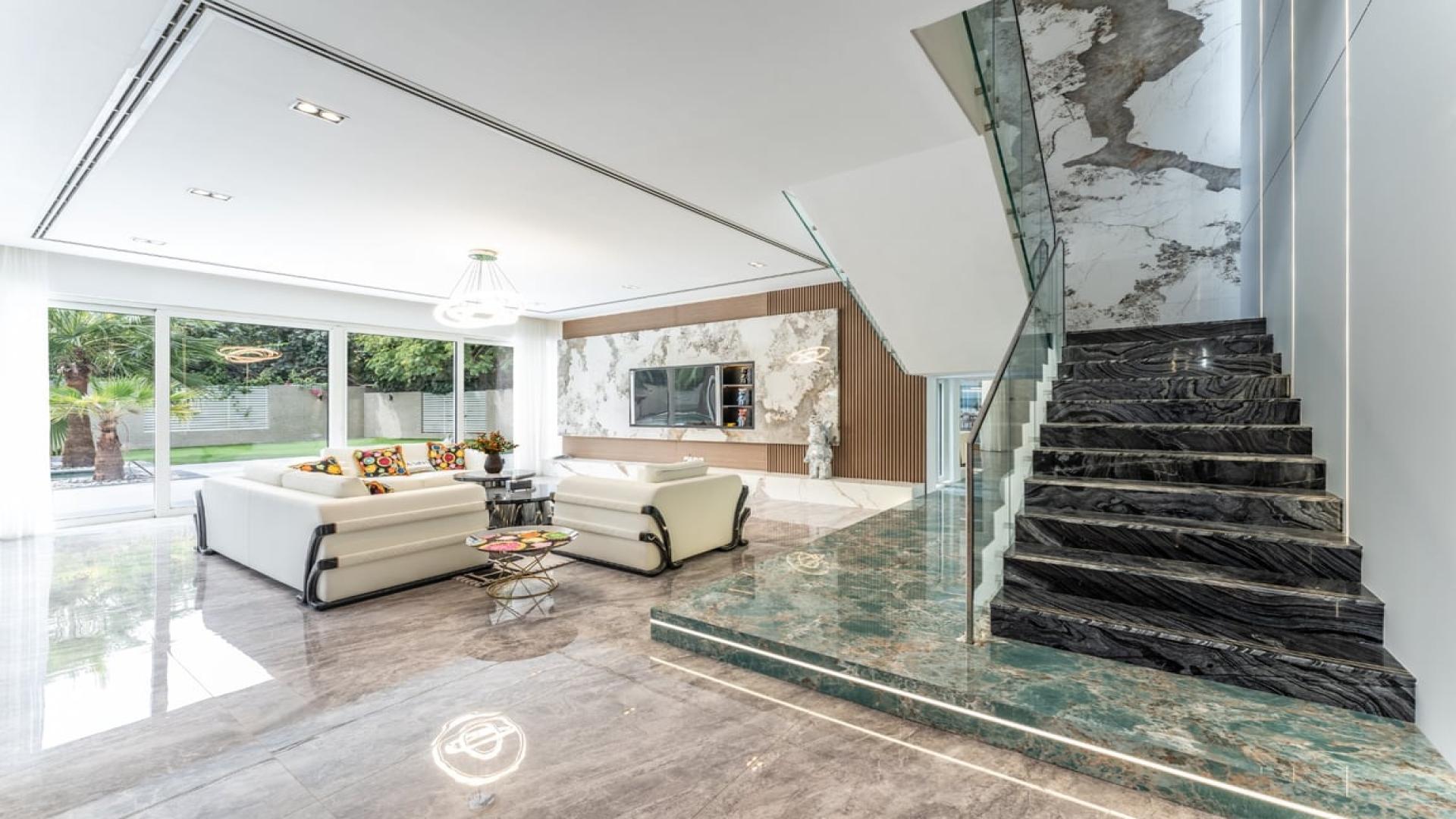 Luxurious Al Barari villa with pool, lush garden, modern design, for sale in The Nest