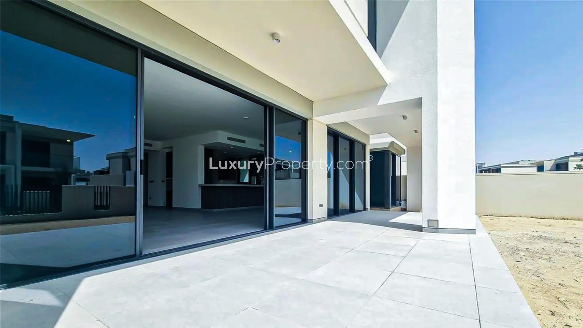 Spacious living area with large windows in Tilal Al Ghaf Harmony 2 villa for sale