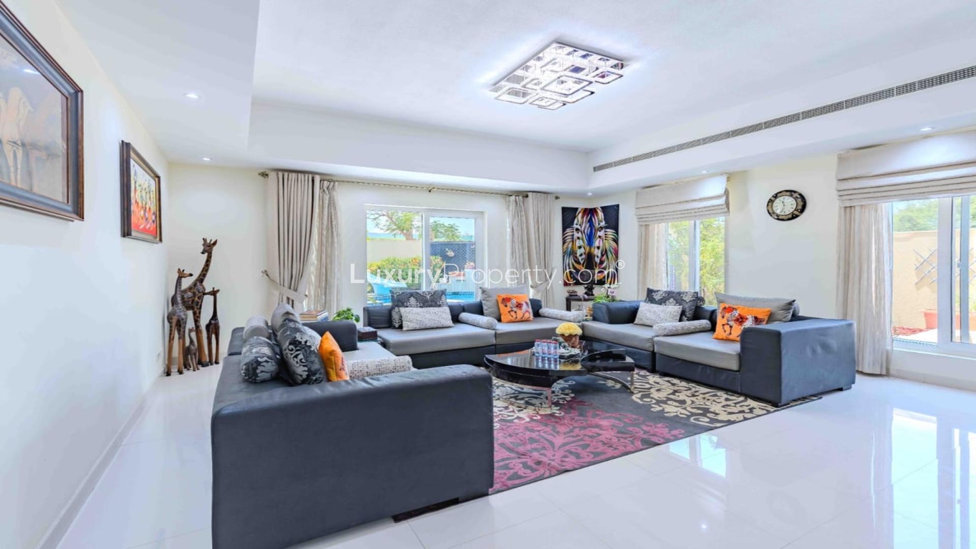 Corner villa exterior in Al Mahra, Arabian Ranches, with landscaped garden and driveway