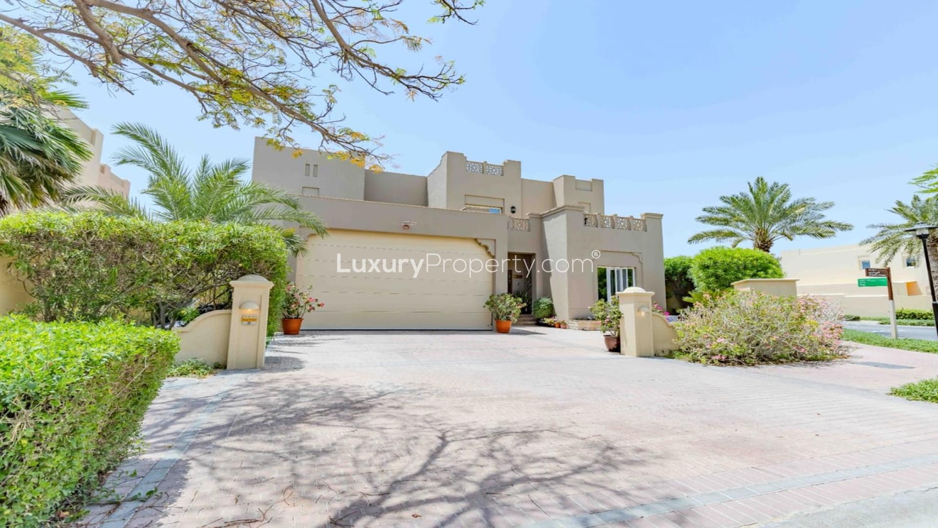 Outdoor pool with slide and pergola in Al Mahra villa, Arabian Ranches