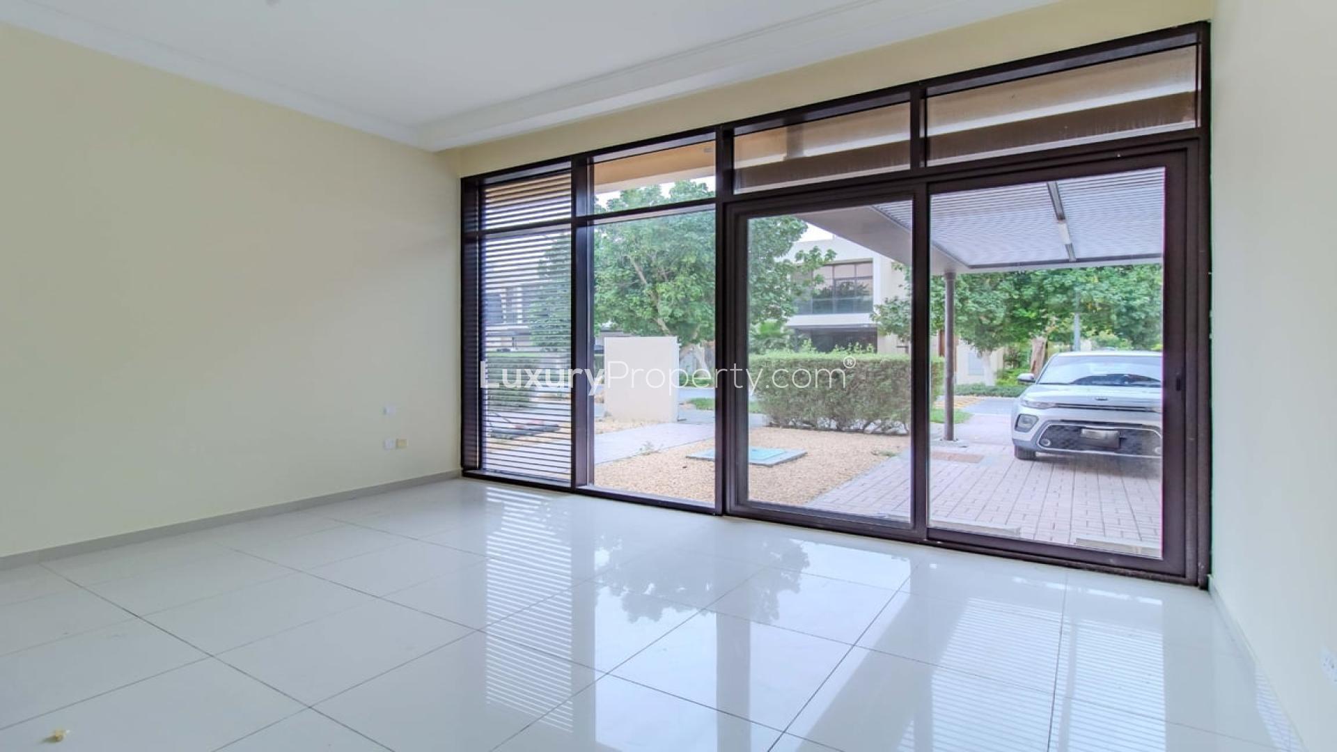 Spacious living room with large windows in Brookfield standalone corner villa, Damac Hills