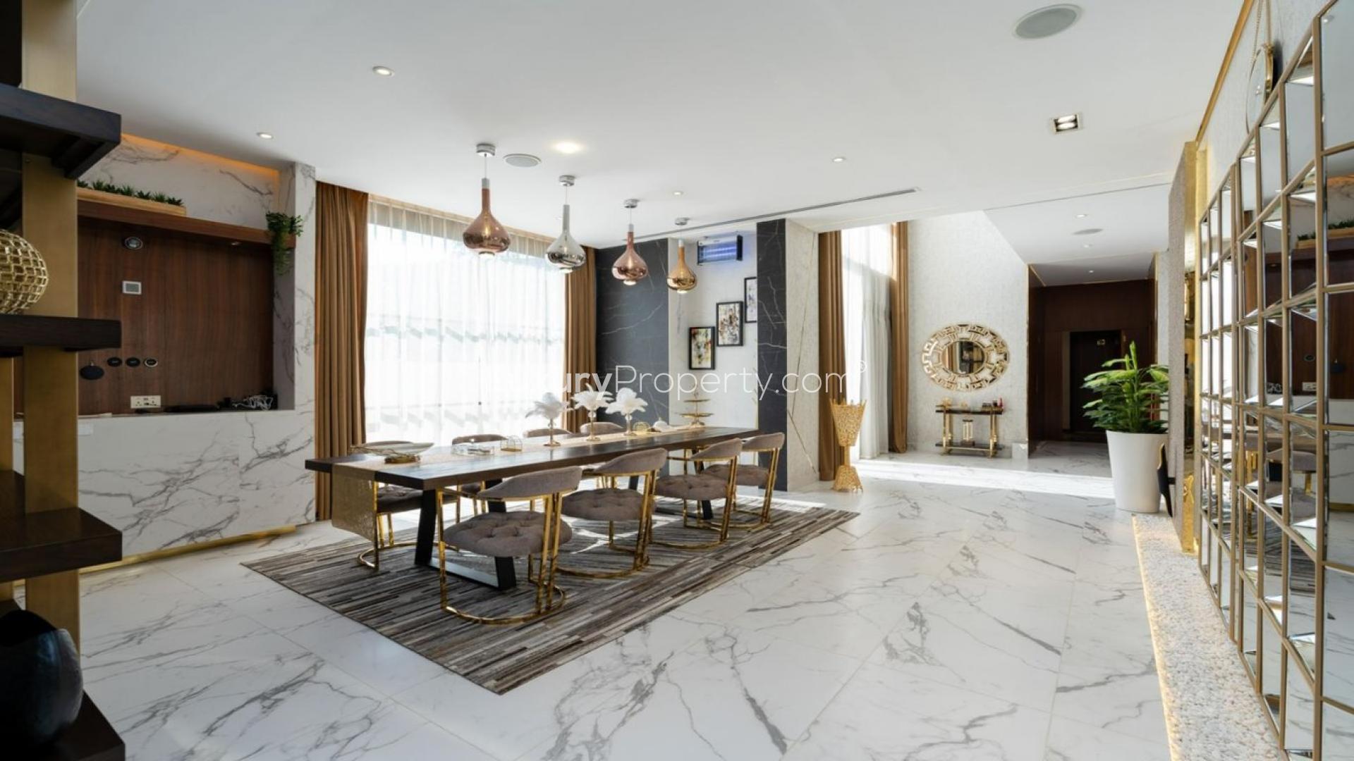 Modern kitchen in luxury 5-bedroom villa, Whitefield, Damac Hills, featuring sleek wooden cabinetry