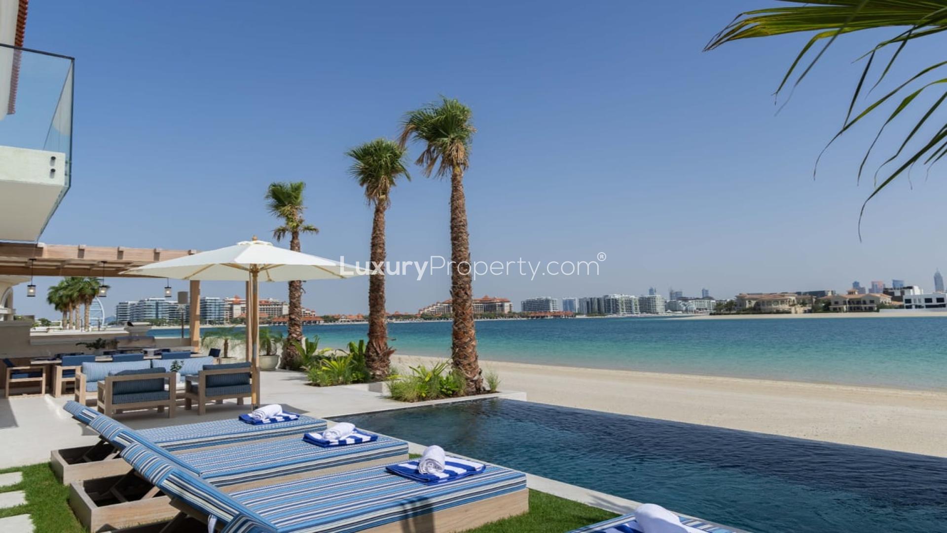 Luxurious villa patio with pool and Burj Al Arab view