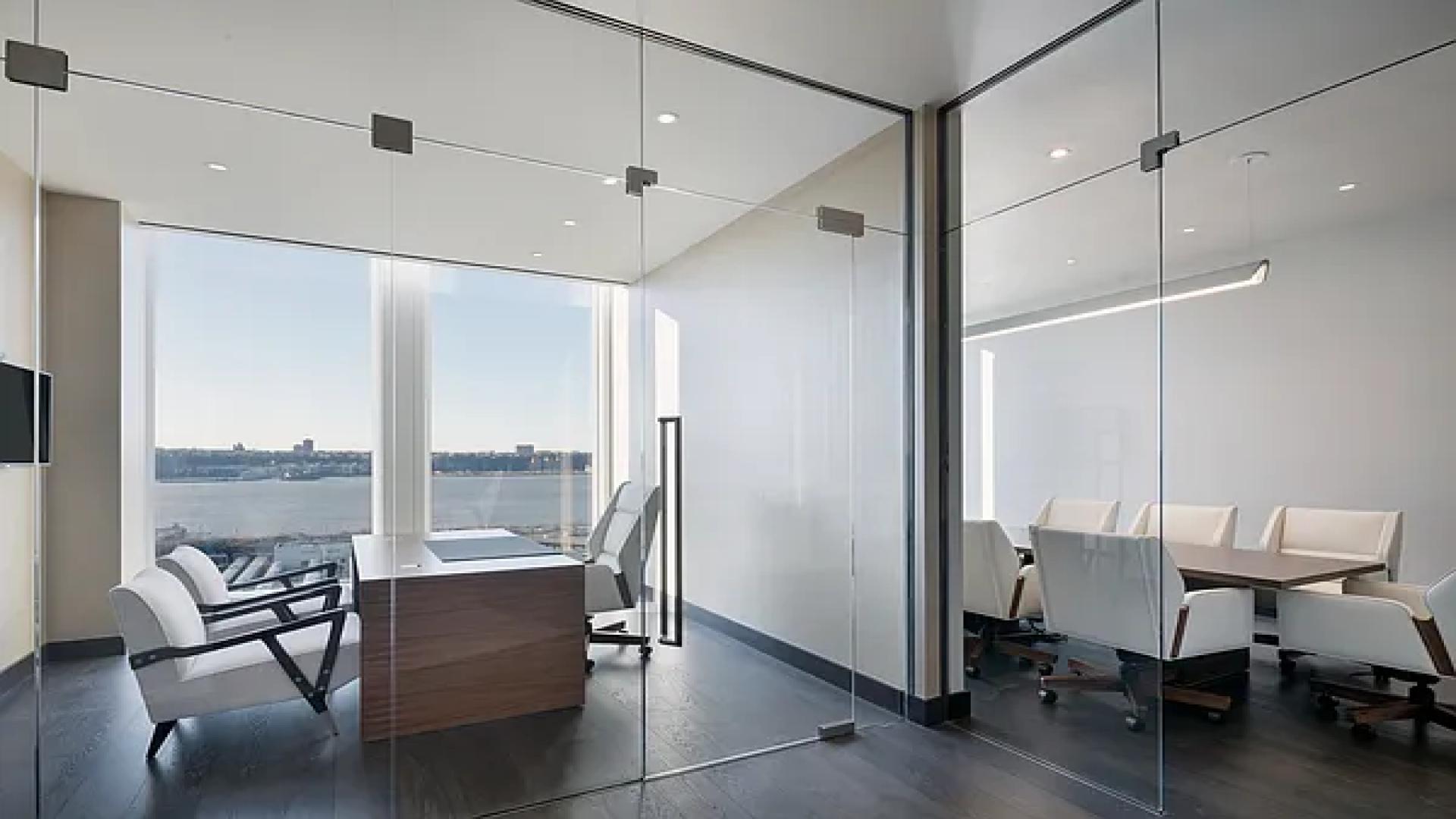 "Bright kitchen with city and river views in 35 Hudson Yards apartment, New York.",Luxurious office space with river views in 35 Hudson Yards apartment, New York