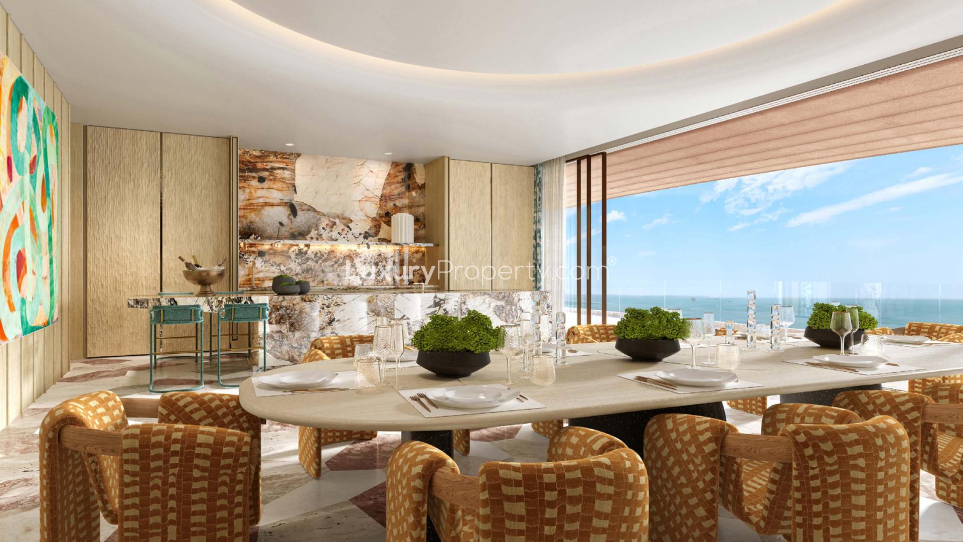 Luxurious living room in Jumeirah Asora Bay apartment with ocean view and modern decor