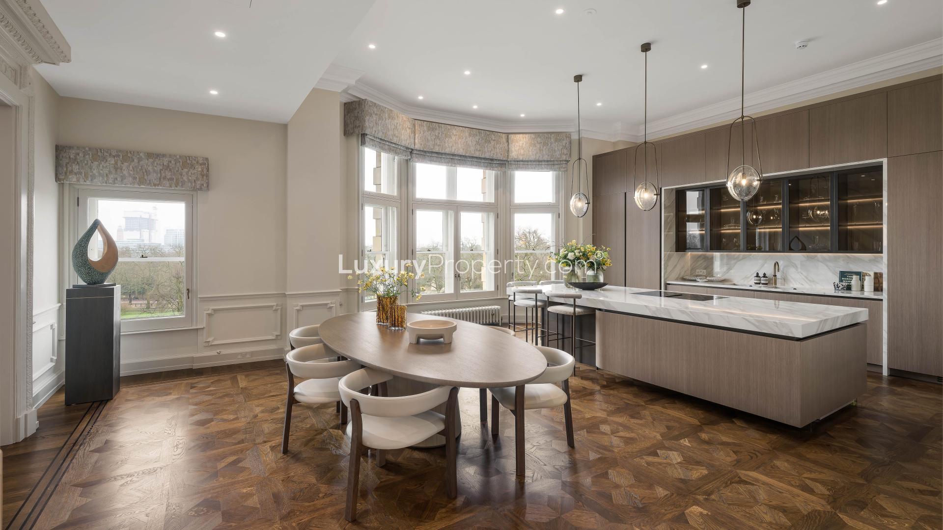 Luxurious dining room with chandelier at The Mulliner, 149 Old Park Lane, London