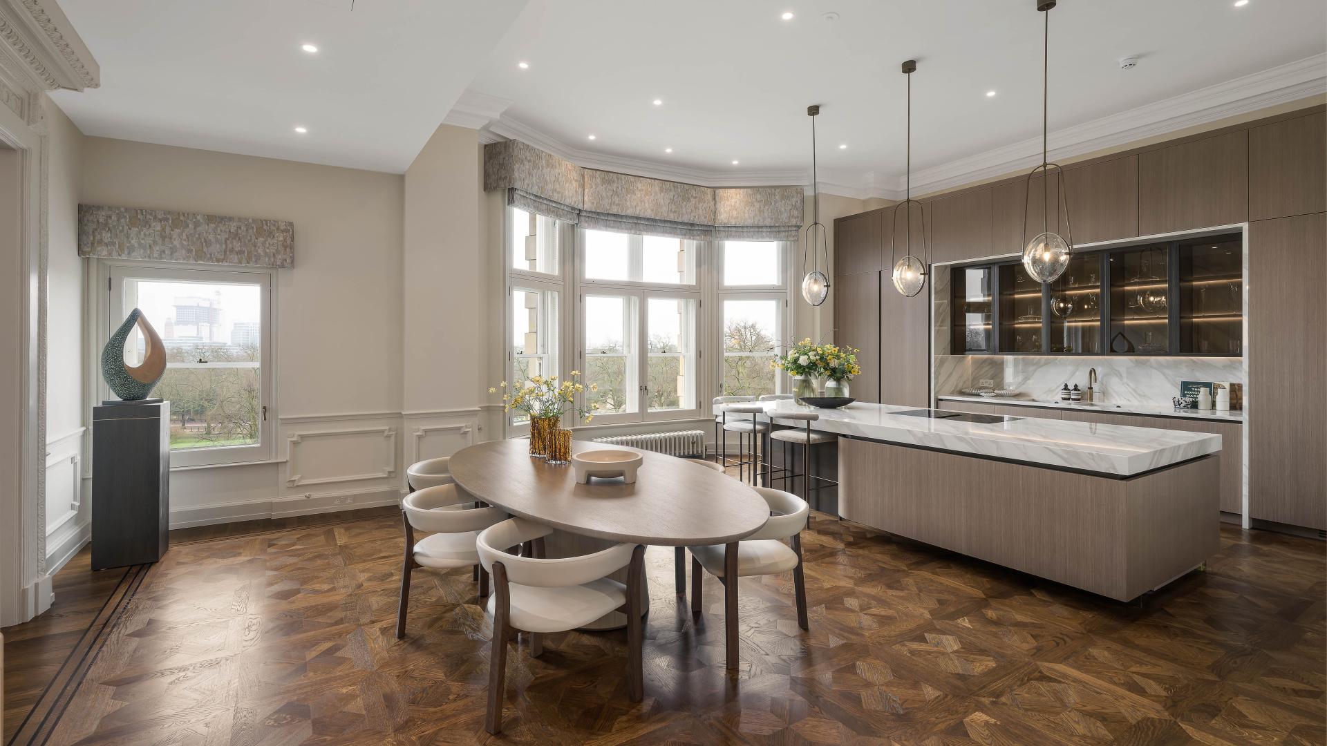 Luxurious dining room with chandelier at The Mulliner, 149 Old Park Lane, London