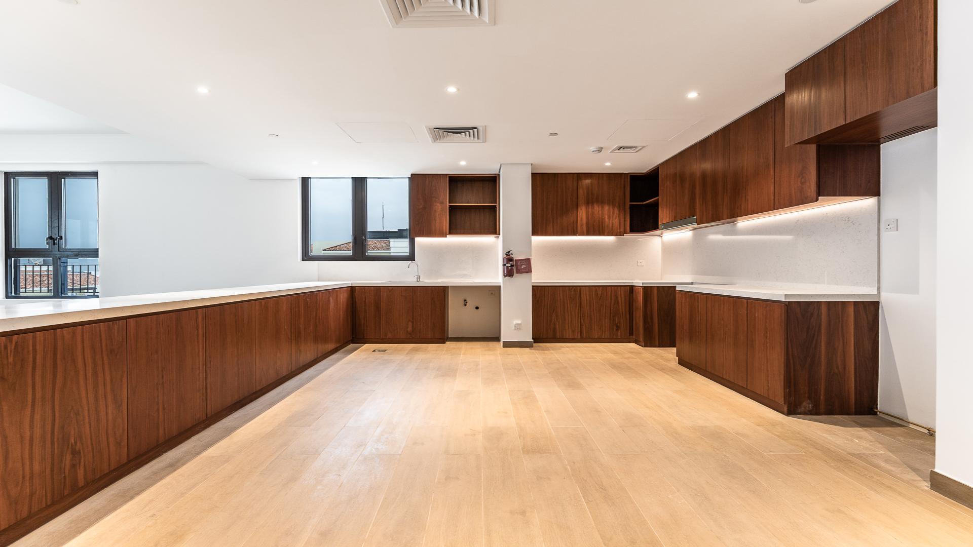 Spacious open-plan living area in Jumeirah 1 apartment for sale, featuring modern design