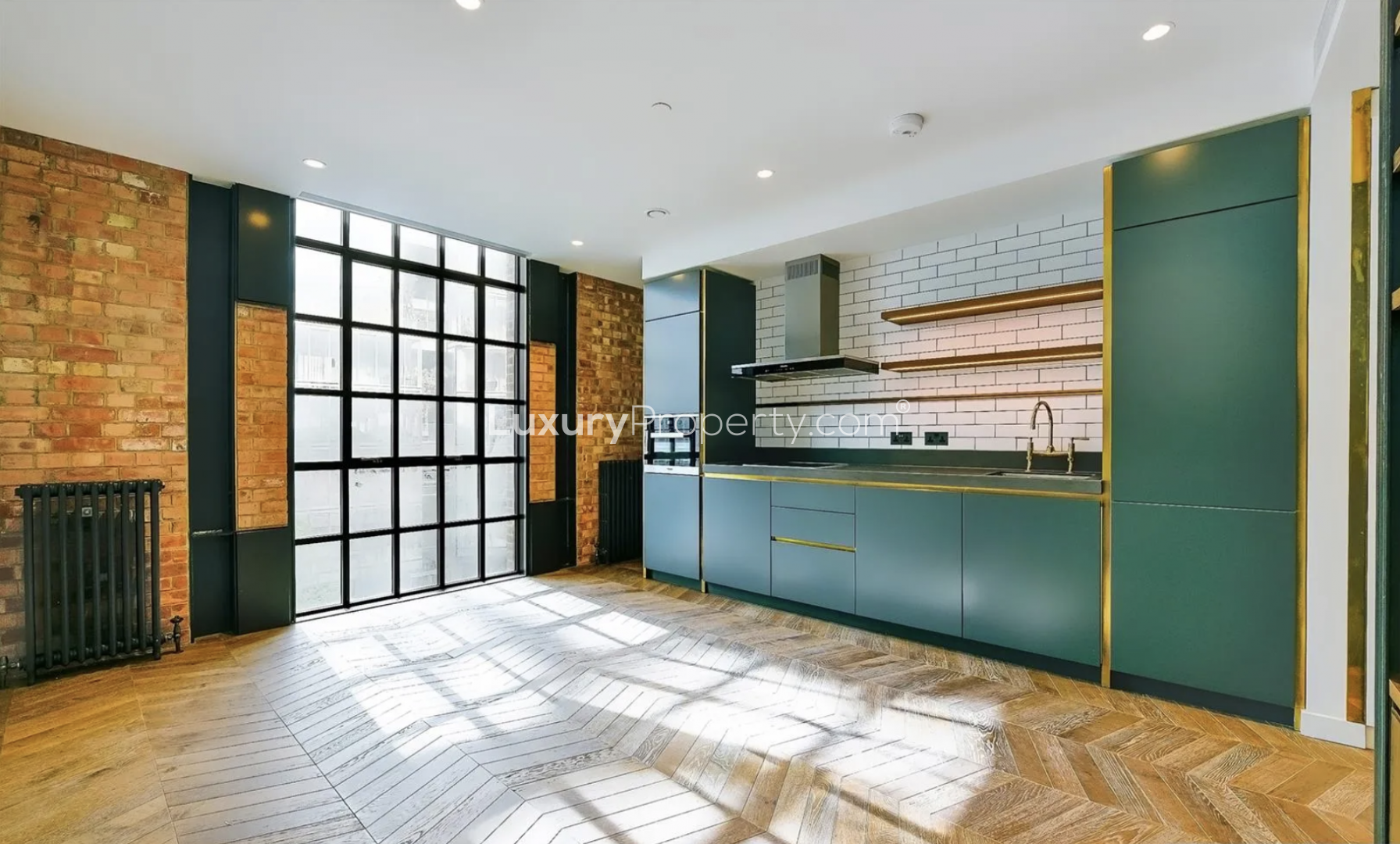 Battersea Power Station apartment exterior with garden, benches, and modern architectural design