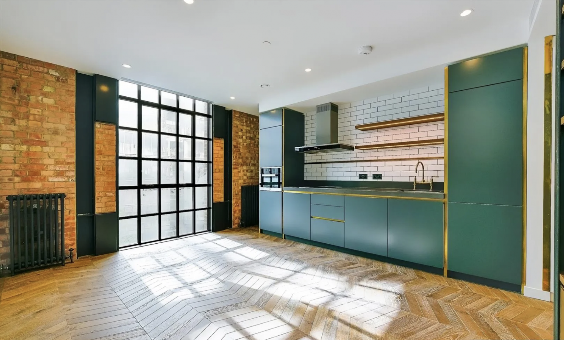 Battersea Power Station apartment exterior with garden, benches, and modern architectural design