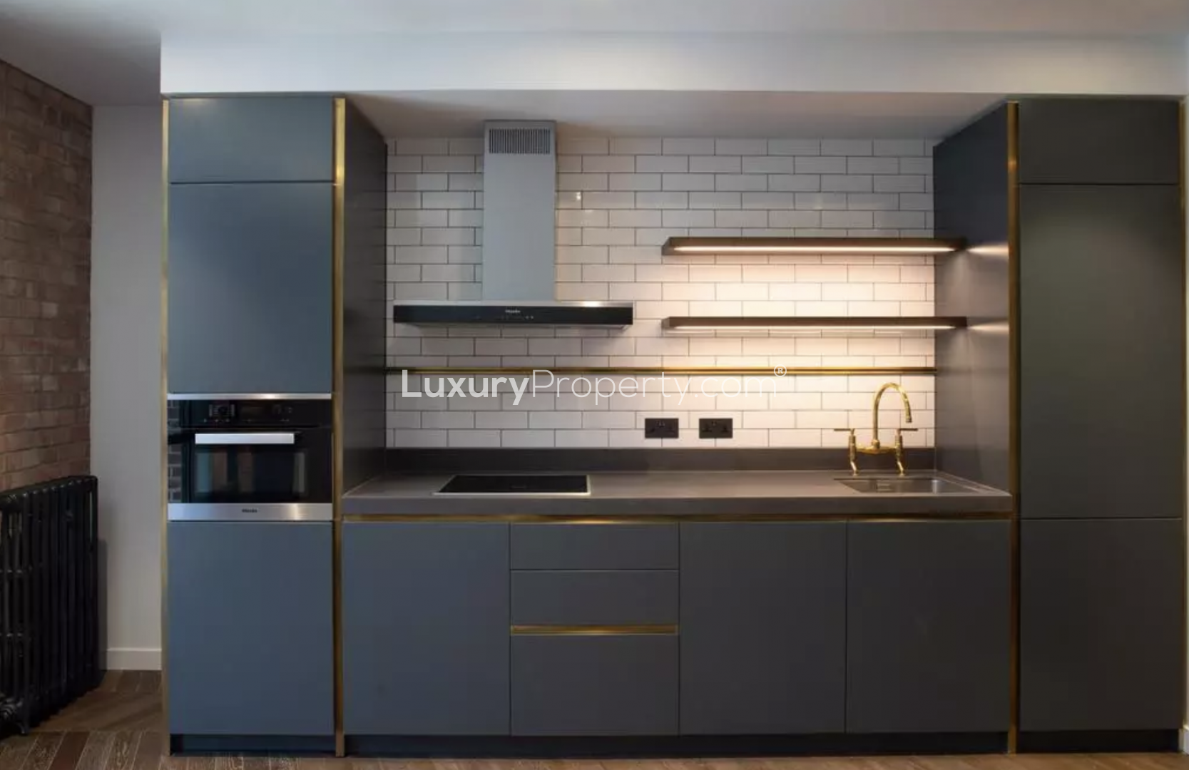 Modern kitchen with large windows in Battersea Power Station apartment, London