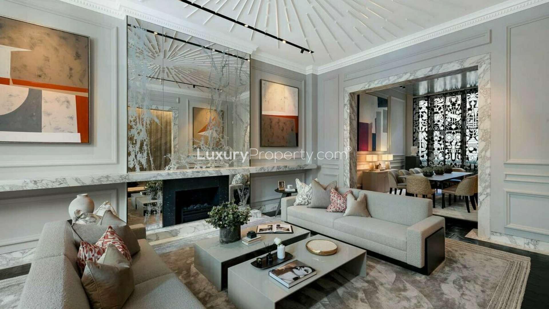 Luxurious living room in a 5-bedroom Cadogan Square apartment, featuring elegant decor and fireplace