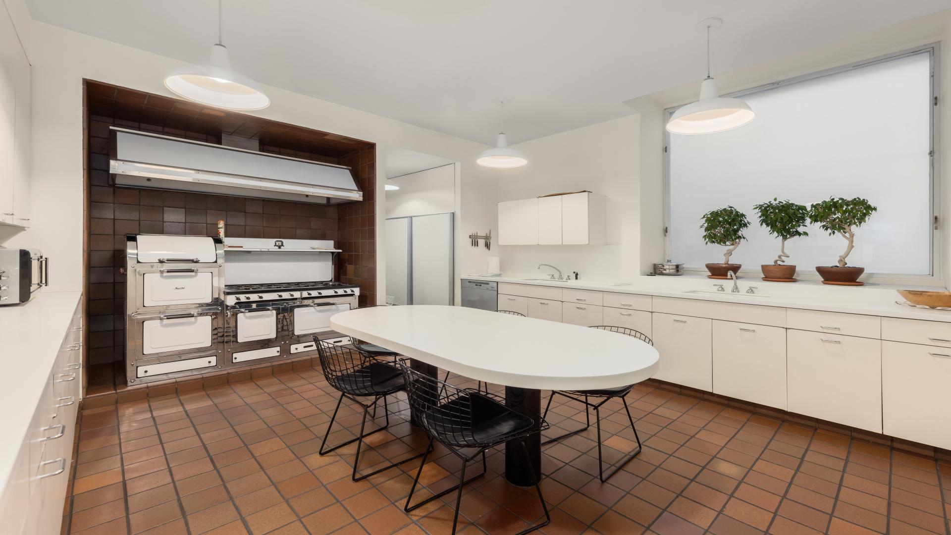 Elegant dining room in Manhattan apartment with tapestry and modern art, Park Avenue listing