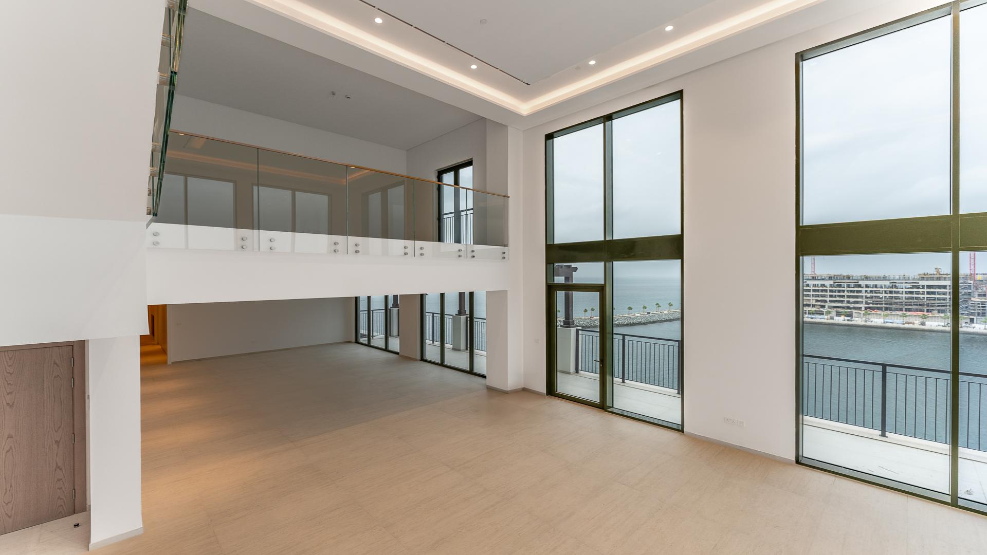 Luxurious La Mer apartment with ocean view, spacious interior, and floor-to-ceiling windows