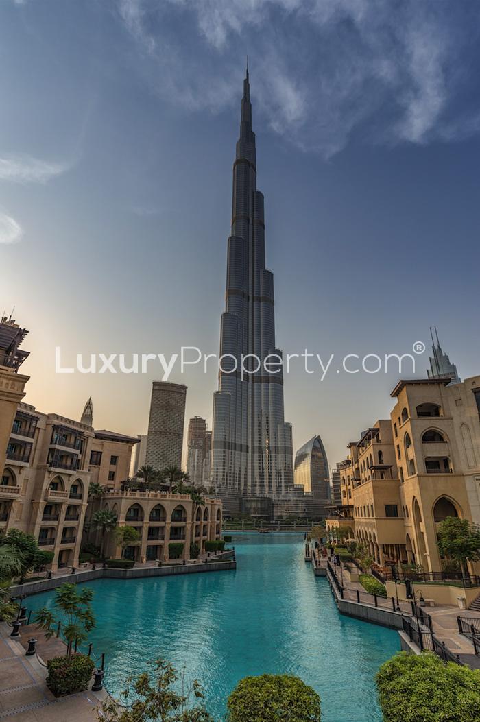 Sunset view of The Address Residences Dubai Opera with fountains and skyline in Downtown Dubai