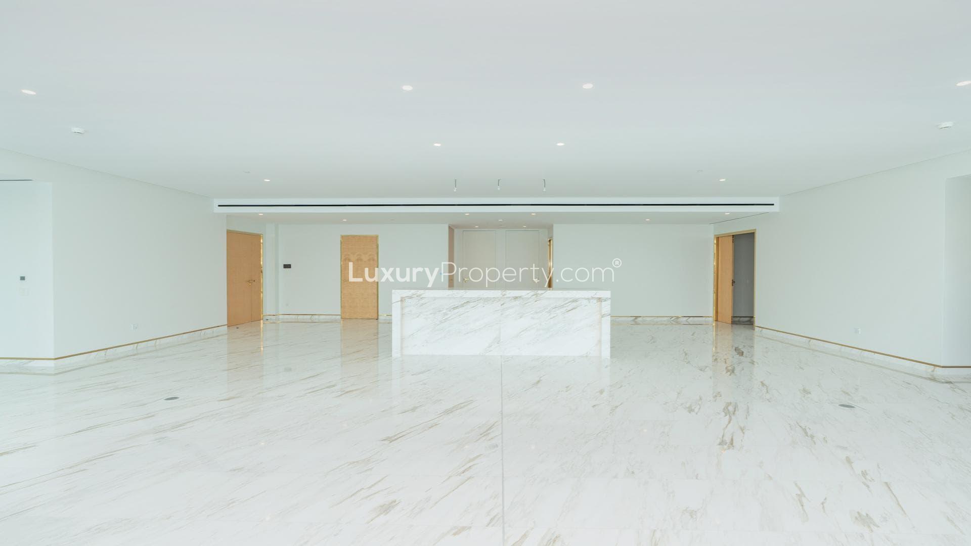 Luxurious open-plan living area with marble flooring in Palm Jumeirah apartment