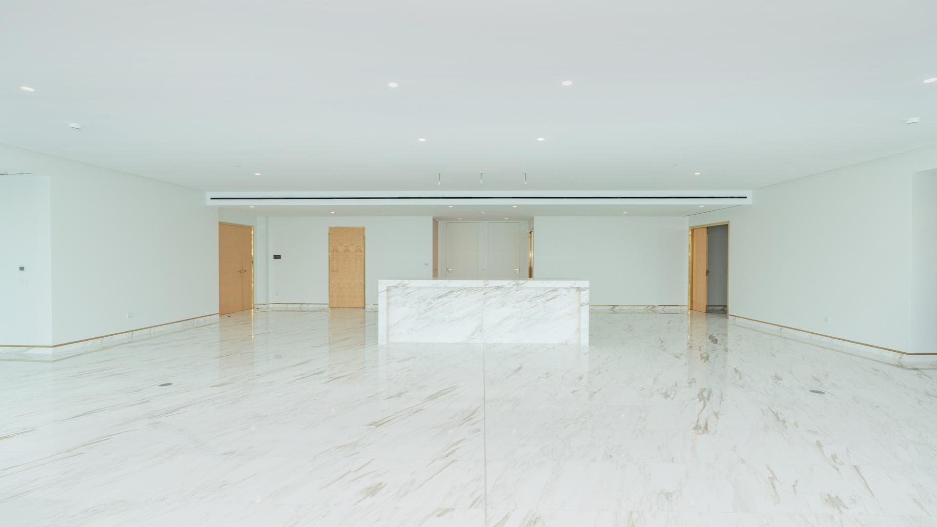 Luxurious open-plan living area with marble flooring in Palm Jumeirah apartment