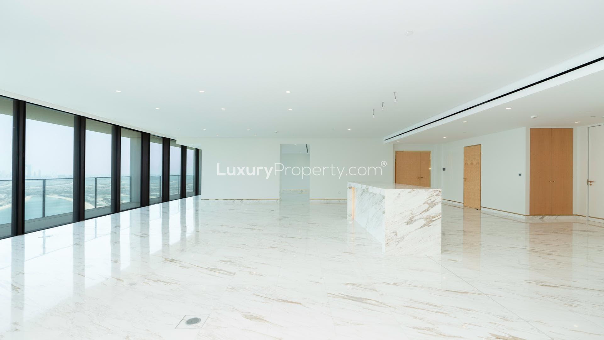Aerial view of Palm Jumeirah islands near Atlantis The Royal Residences, Dubai skyline in background