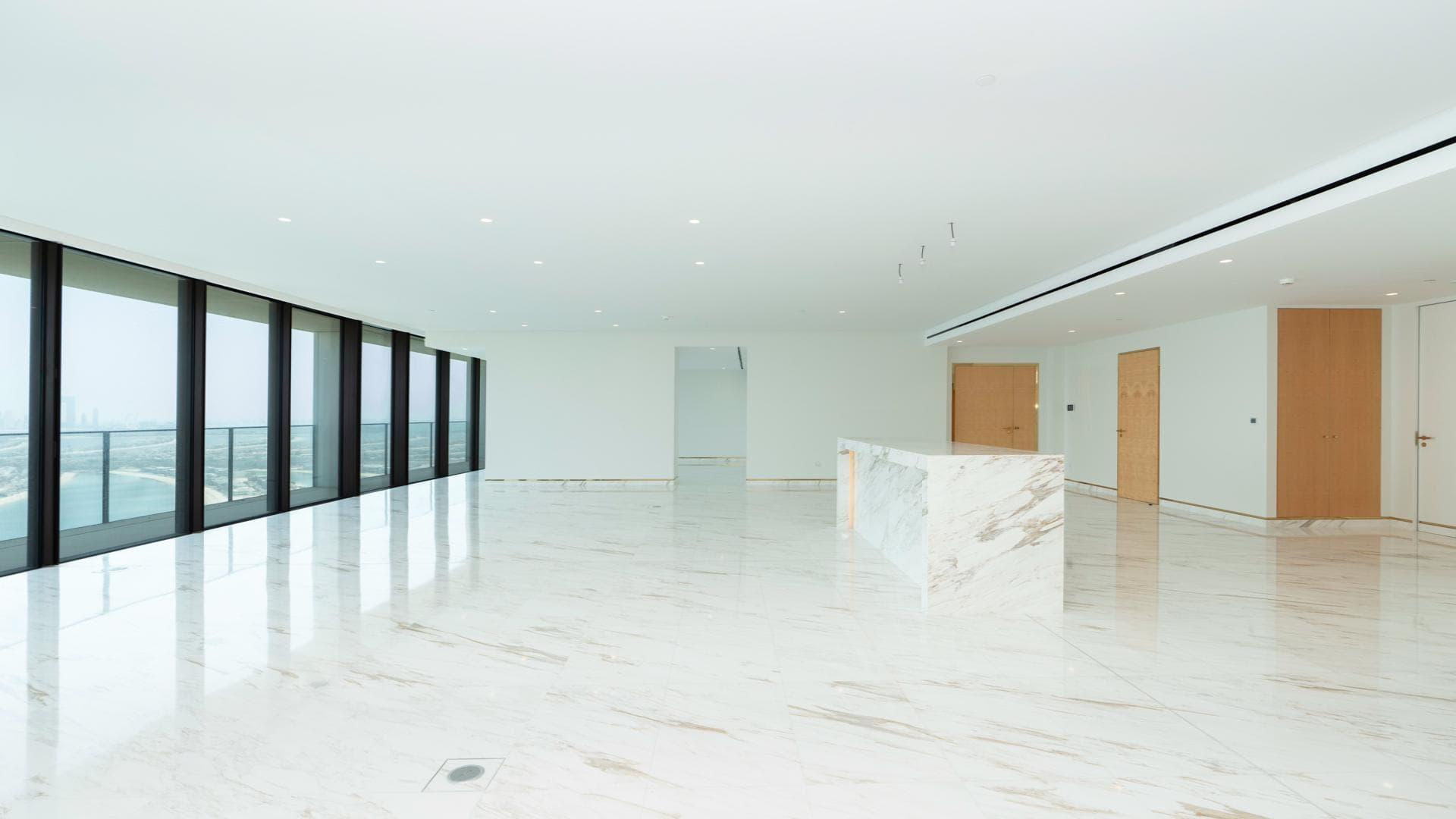 Aerial view of Palm Jumeirah islands near Atlantis The Royal Residences, Dubai skyline in background