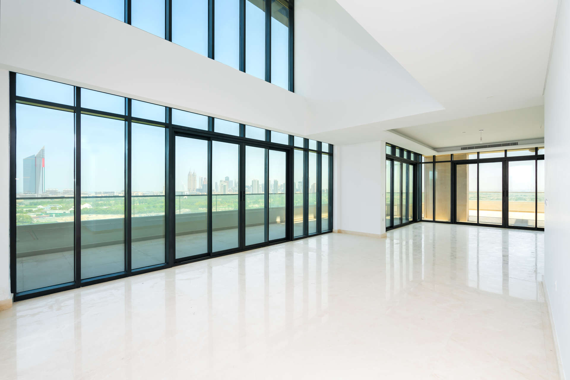 Five-bedroom penthouse view, The Hills A, overlooking lush golf course and modern buildings