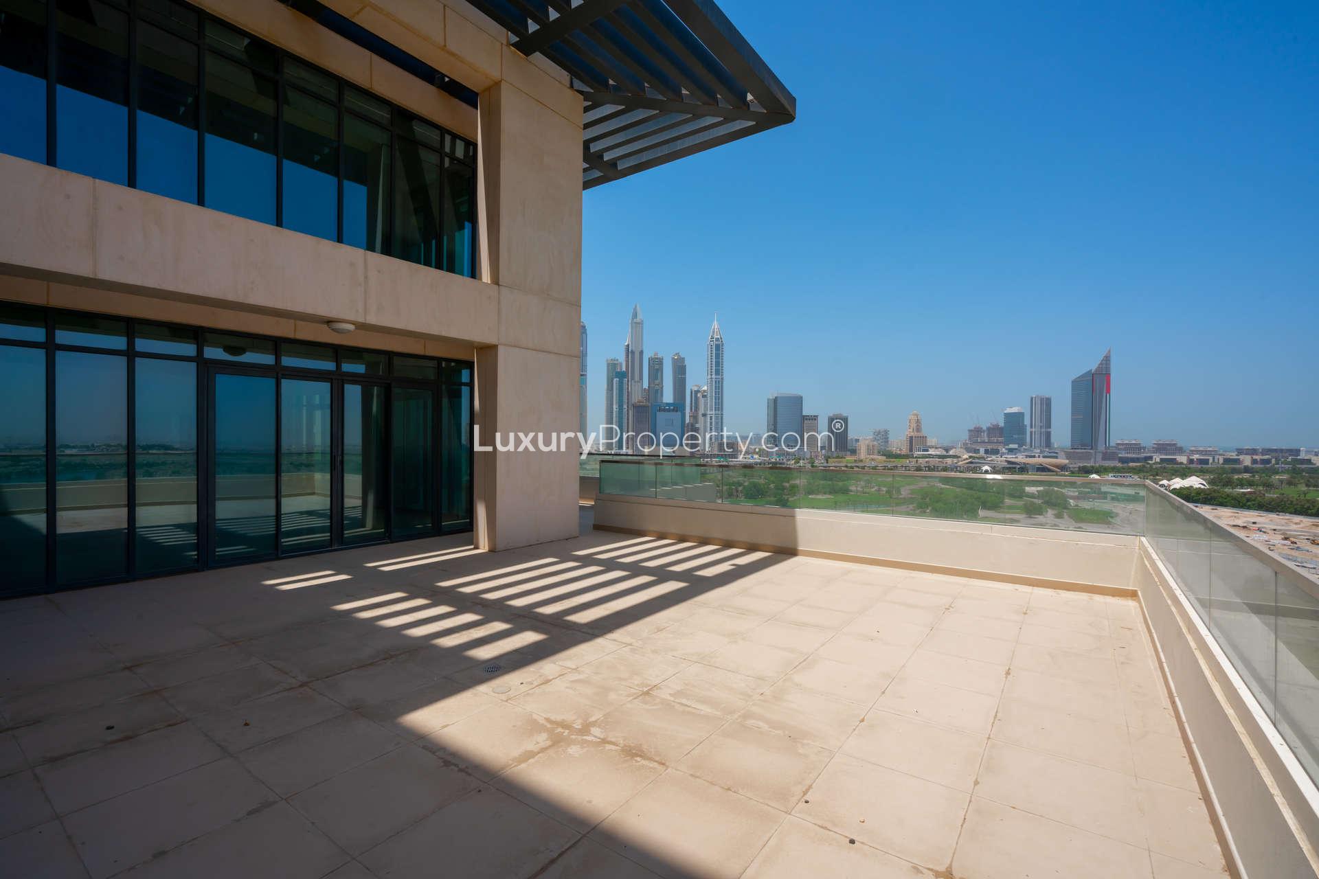 Spacious living area with floor-to-ceiling windows in The Hills duplex penthouse, Dubai