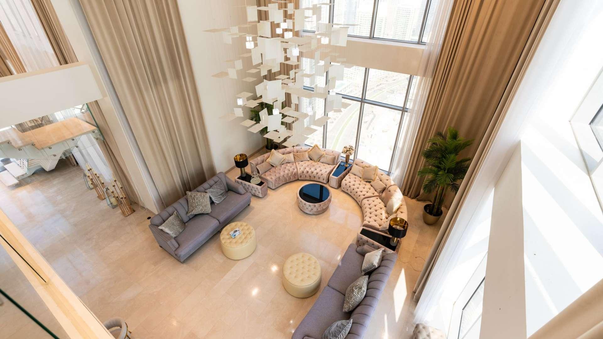 Luxurious living room in Downtown Dubai penthouse with Burj Khalifa view, modern decor