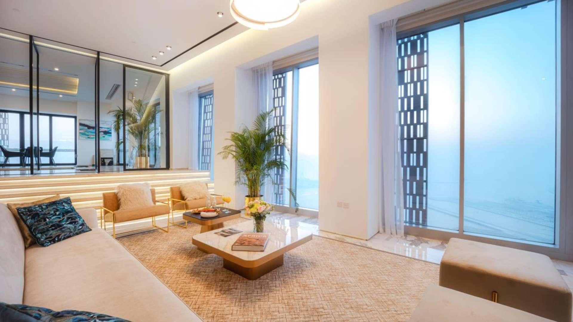 Luxurious living room in 5-bedroom penthouse, Cayan Tower, Dubai Marina with pool view