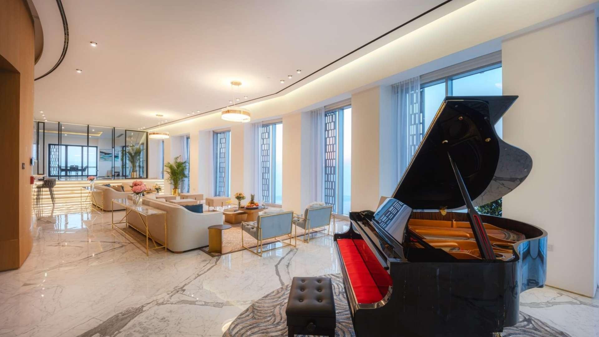 Luxurious living area in 5-bedroom penthouse, Cayan Tower, Dubai Marina, featuring grand piano