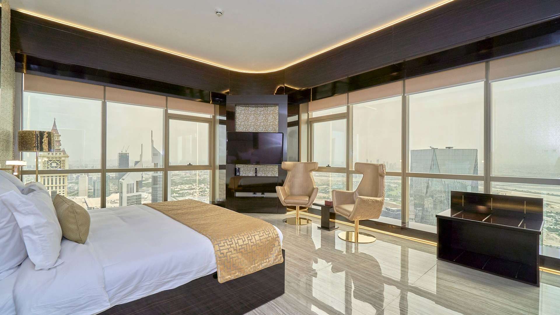 Luxurious bedroom in DIFC penthouse with city view, elegant decor, and modern furnishings