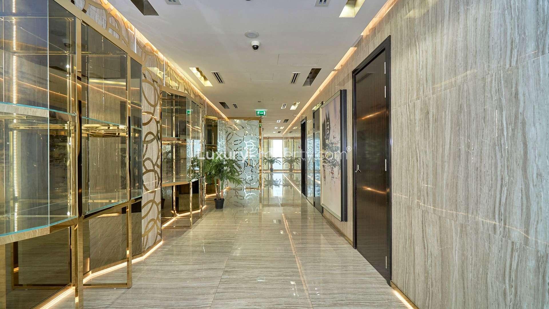 Luxurious DIFC penthouse bedroom with city view, elegant furnishings, and modern decor