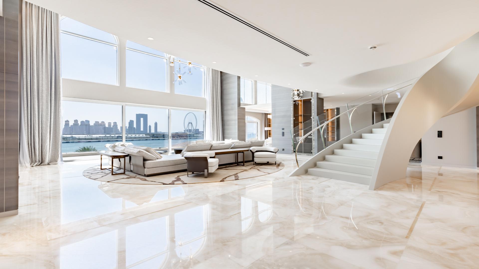Luxurious living room in XXII Carat villa with stunning Palm Jumeirah skyline views