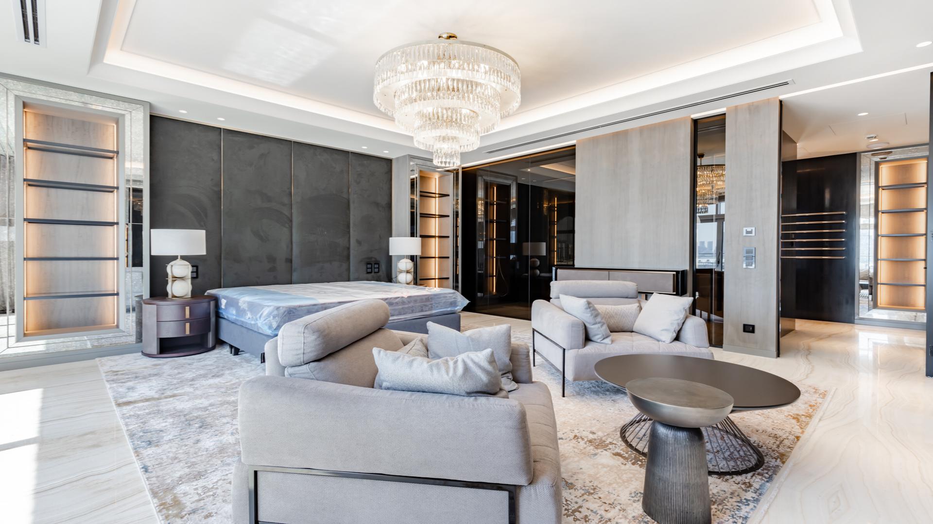 Luxurious XXII Carat villa interior with skyline views, elegant staircase, and modern furnishings